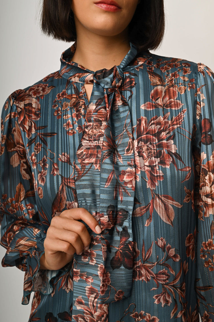 Blusa con fiocco e stampa floreale