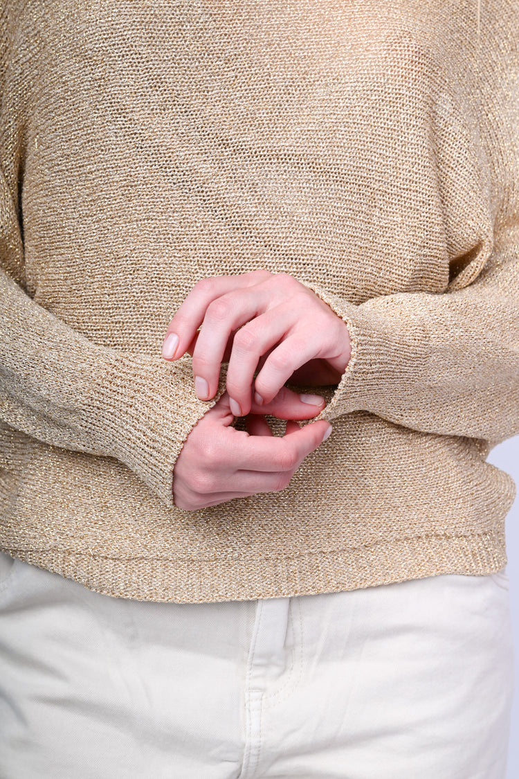 Pull asimmetrico in maglia lurex