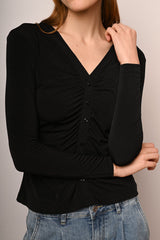 Top a maniche lunghe con bottoni