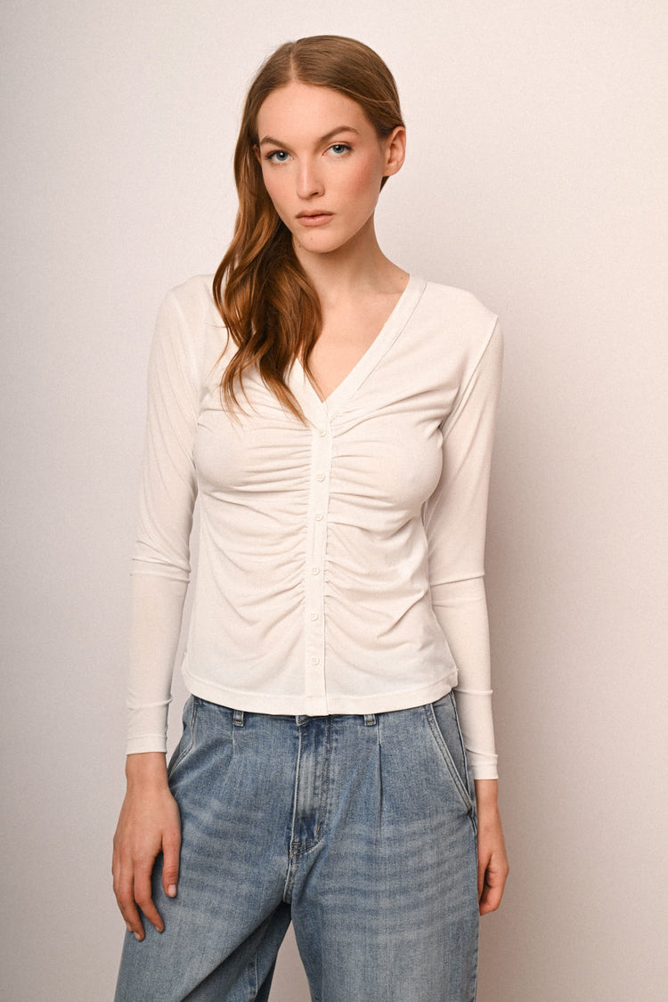 Top a maniche lunghe con bottoni