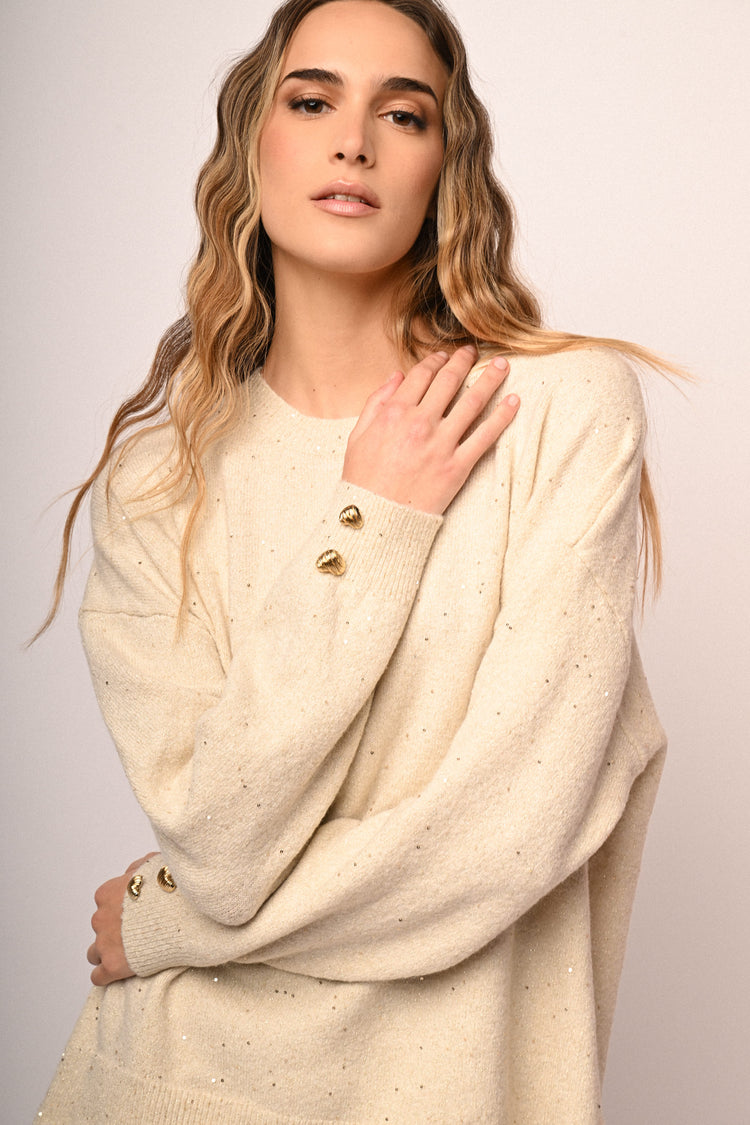 Pull con bottoni a cuore e strass