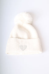 Berretto con pompon e cuore in strass