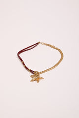 Collana in metallo e similpelle con fiore