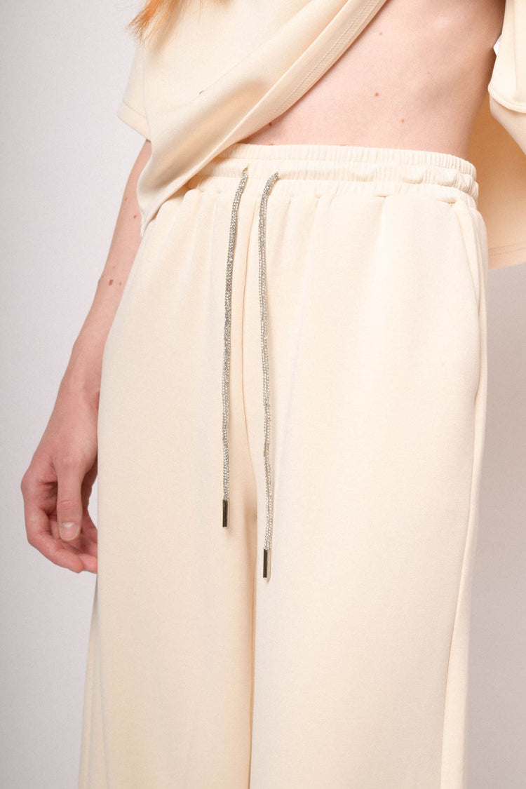 Joggers a gamba ampia misto modal avorio con coulisse in strass