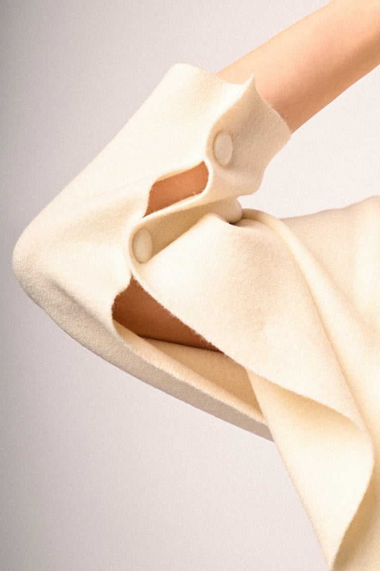Pull a poncho con bottoni