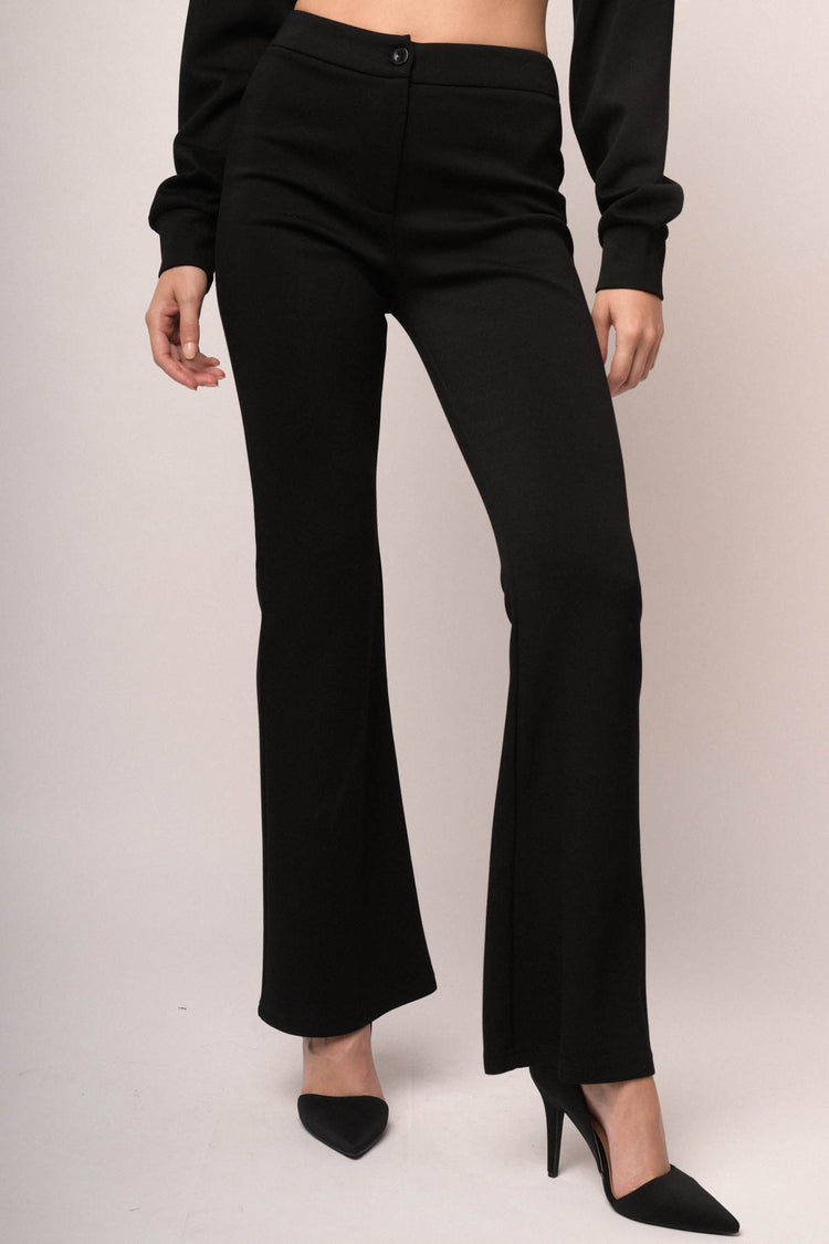 Pantaloni in jersey felpato nero a gamba svasata