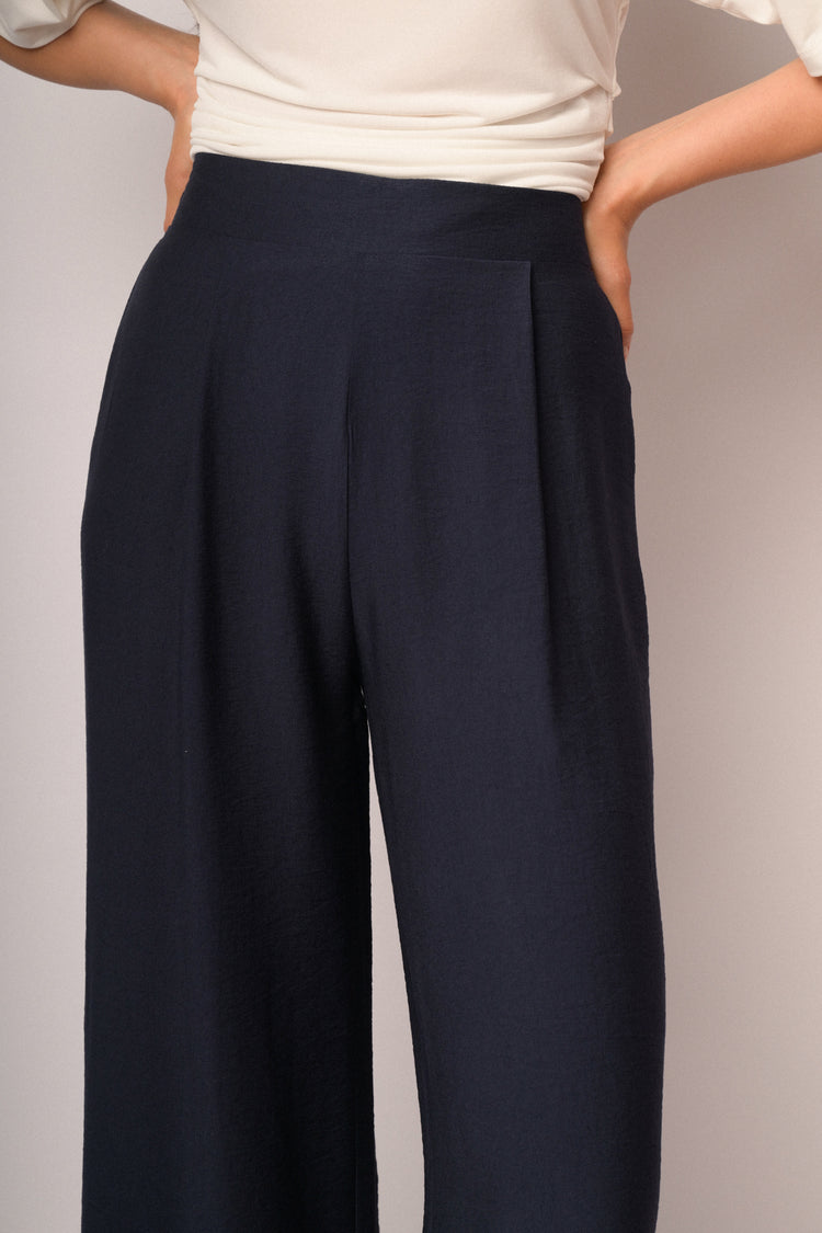 Pantaloni palazzo blu con risvolto