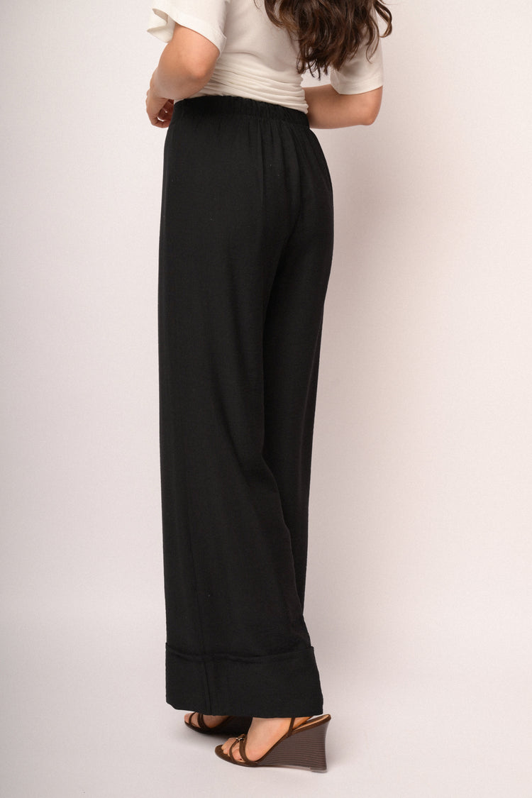 Pantaloni palazzo neri con risvolto