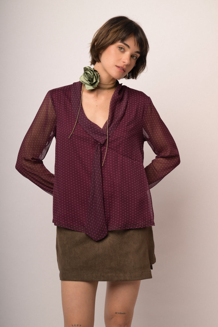 Blusa in tulle bordeaux a stampa con nastro