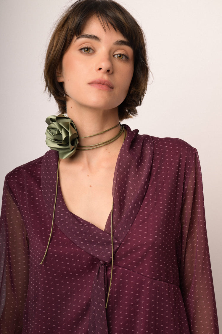 Blusa in tulle bordeaux a stampa con nastro