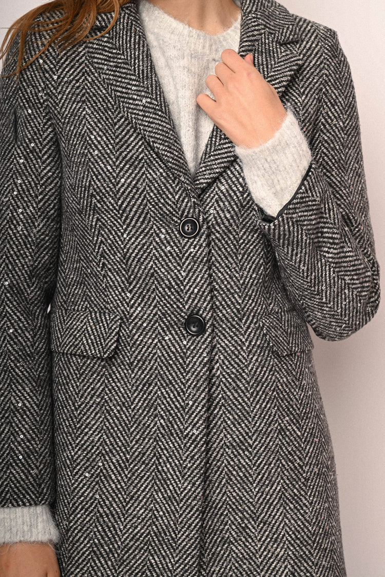 Cappotto con motivo chevron e paillettes