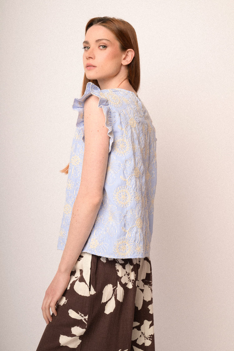 Top a righe azzurro con ricami floreali
