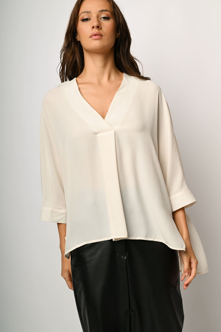 Blusa asimmetrica con scollo a V