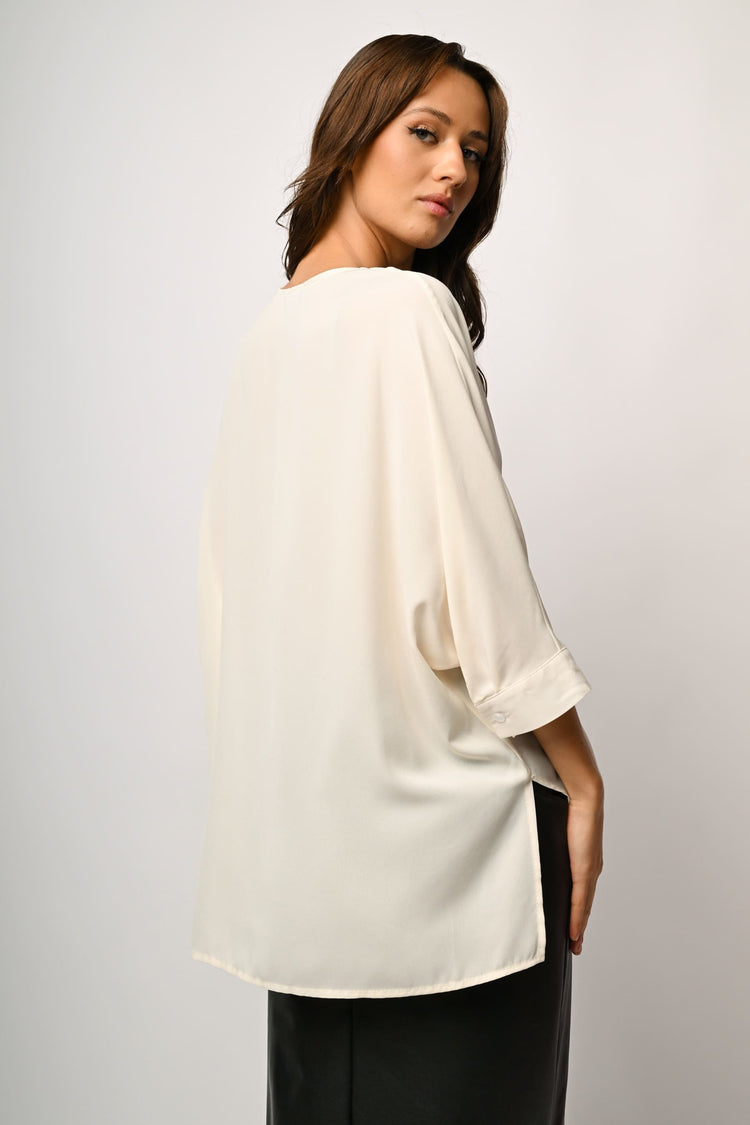 Blusa asimmetrica con scollo a V