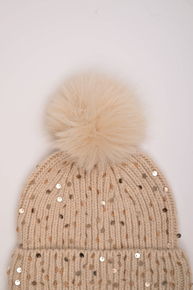 Berretto con paillettes e pompon