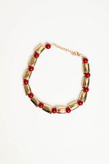 Collana con placche dorate e perle rosse