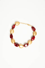 Collana con pietre dorate e rosse