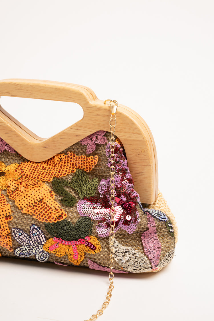 Borsa clutch multicolor con paillettes e manico in legno