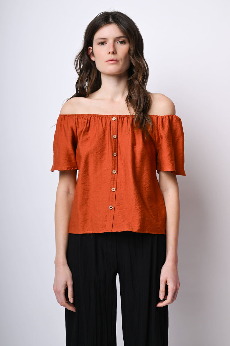 Top a spalle scoperte con bottoni