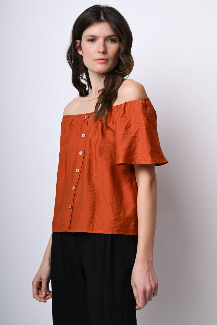Top a spalle scoperte con bottoni