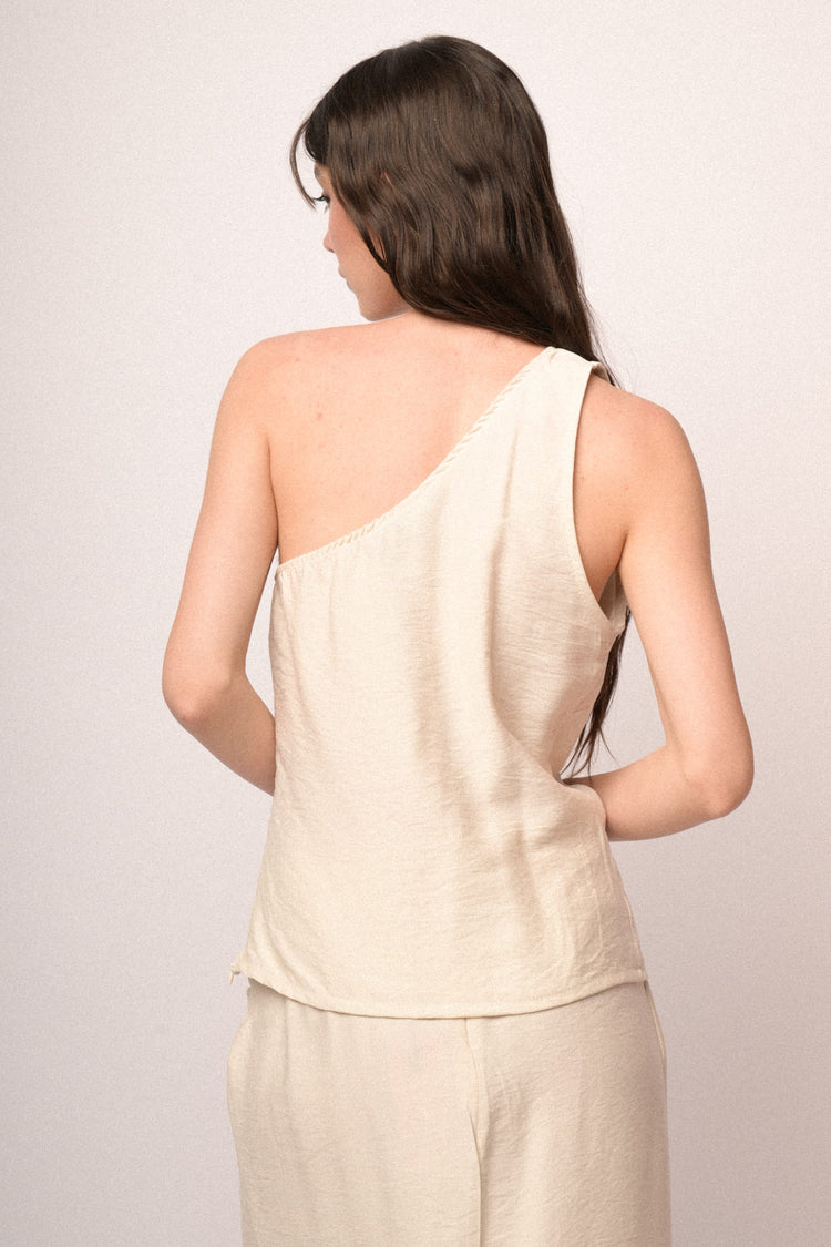 Top monospalla beige con fiore 3D