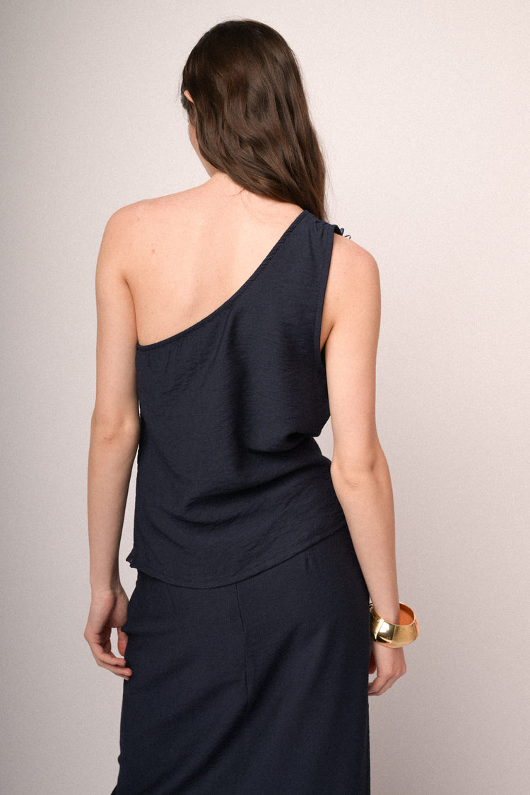 Top monospalla blu con fiore 3D