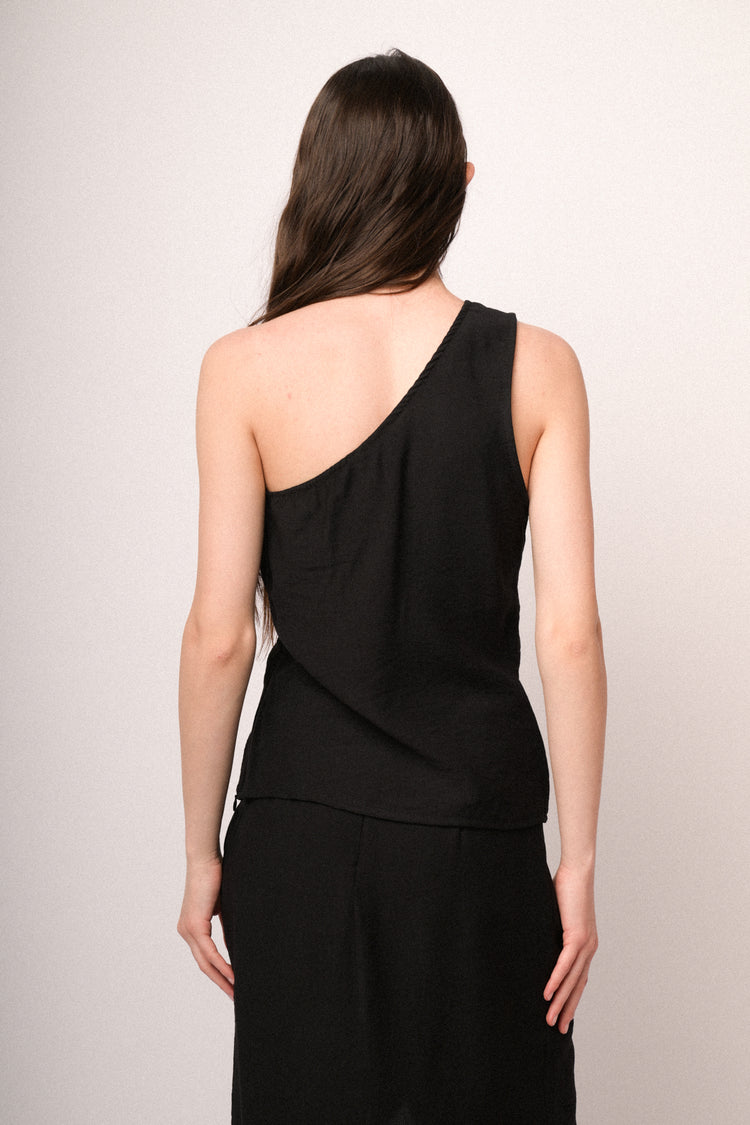 Top monospalla nero con fiore 3D