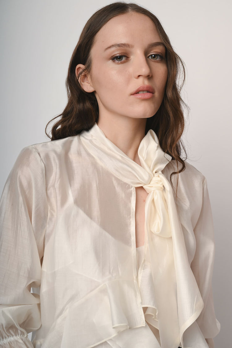 Blusa con fiocco e maniche lunghe