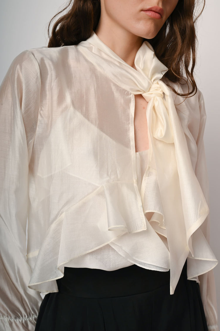 Blusa con fiocco e maniche lunghe