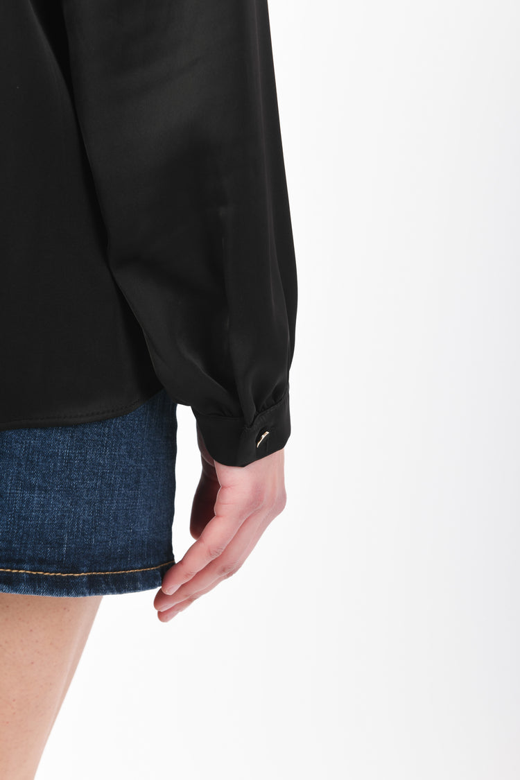 Blusa con taschini