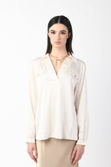 Blusa con taschini