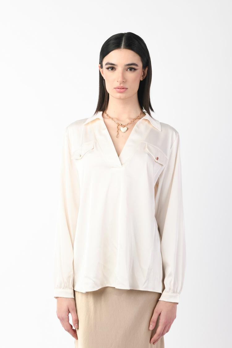Blusa con taschini