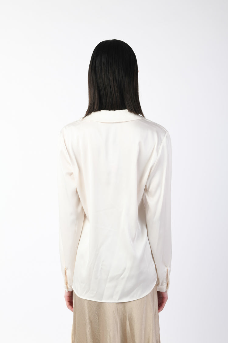 Blusa con taschini