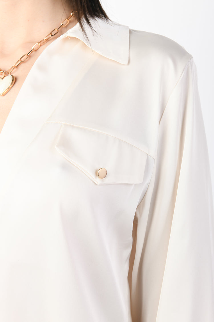 Blusa con taschini
