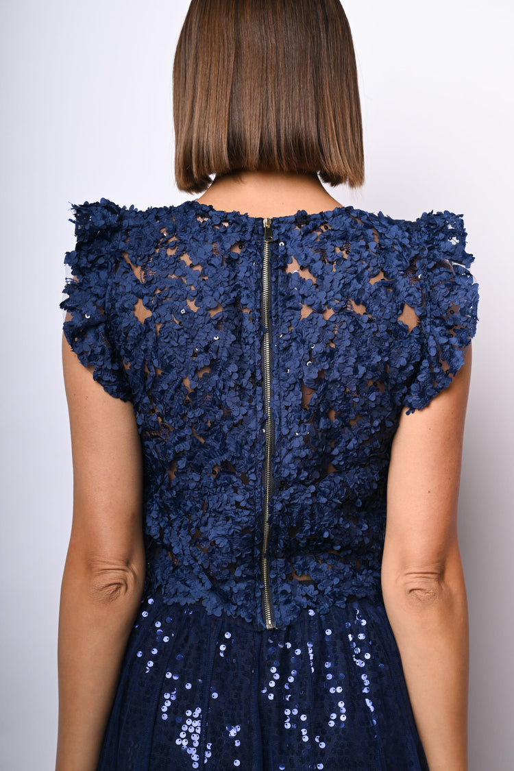 Top crop in pizzo floreale con paillettes