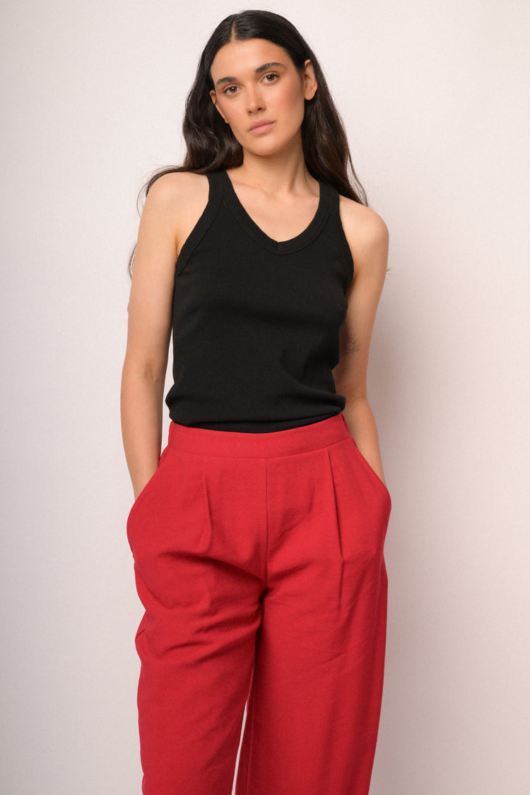 Pantaloni cropped rossi con bottoni al fondo