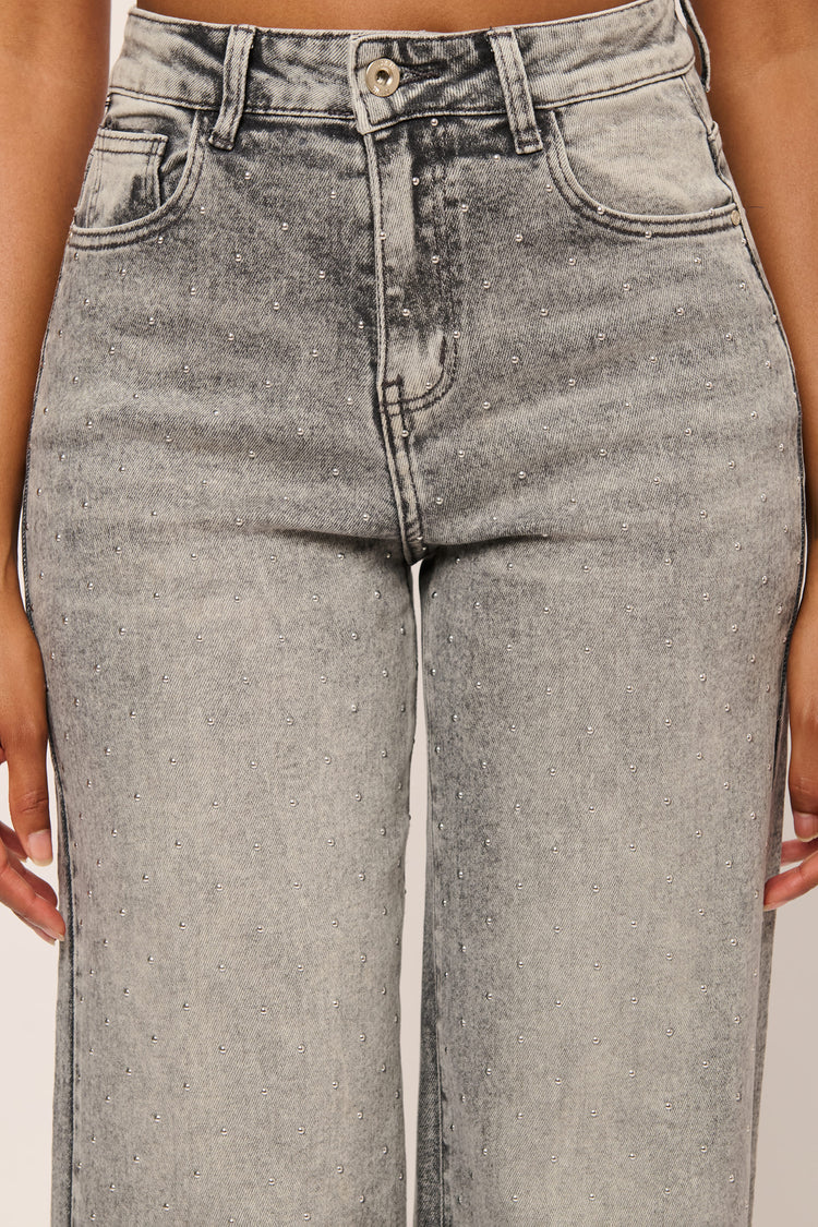 Jeans palazzo con mini borchie