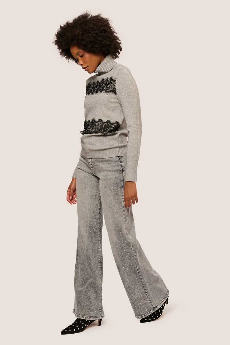 Jeans palazzo con mini borchie
