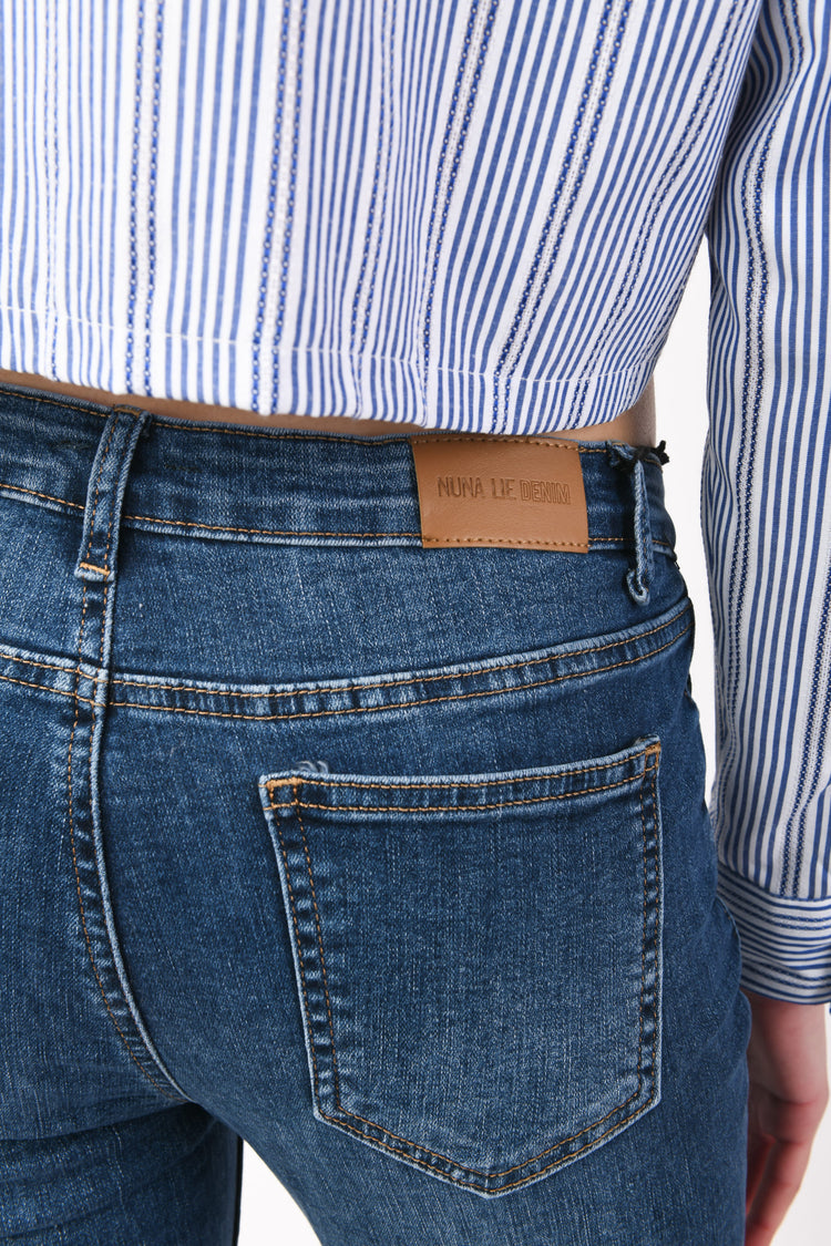Jeans skinny con bottoni gioiello