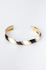 Bracciale rigido a bande diagonali