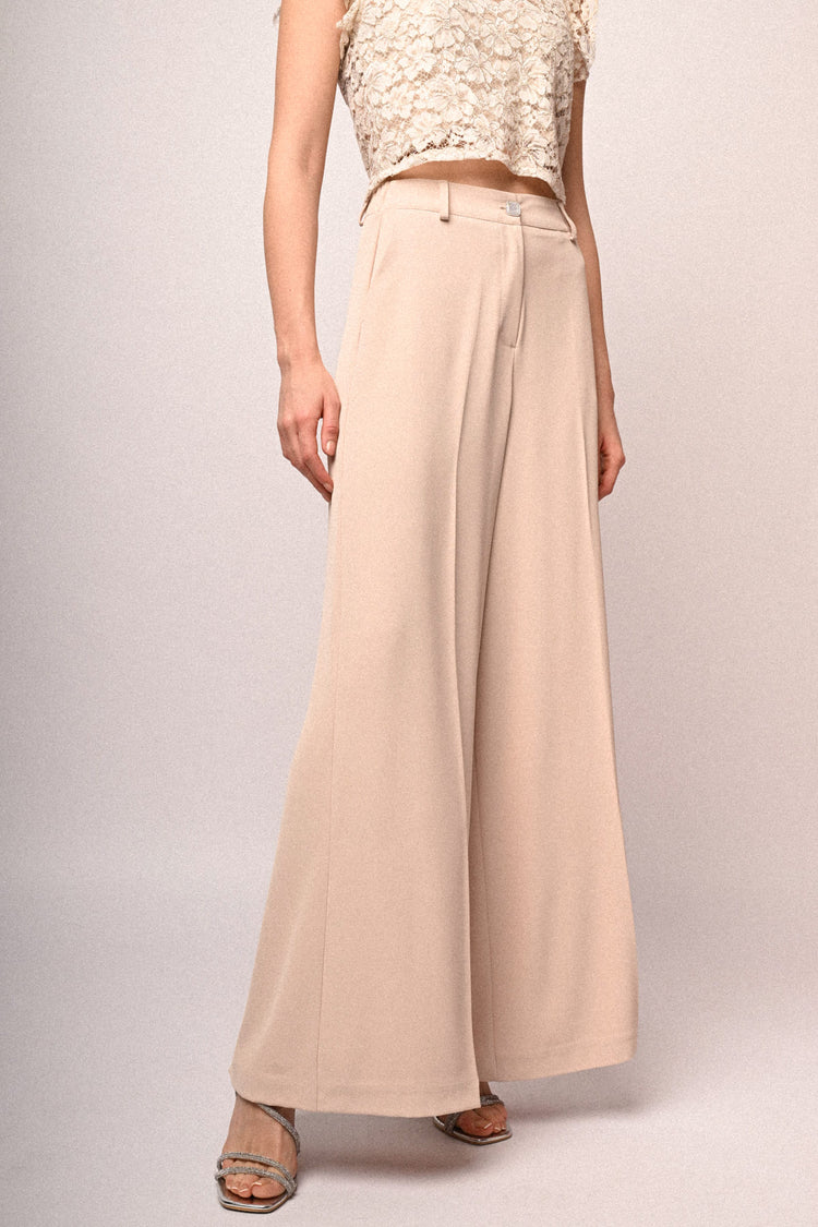 Pantaloni palazzo con bottone gioiello