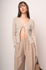 Cardigan in maglia lurex beige con laccetti