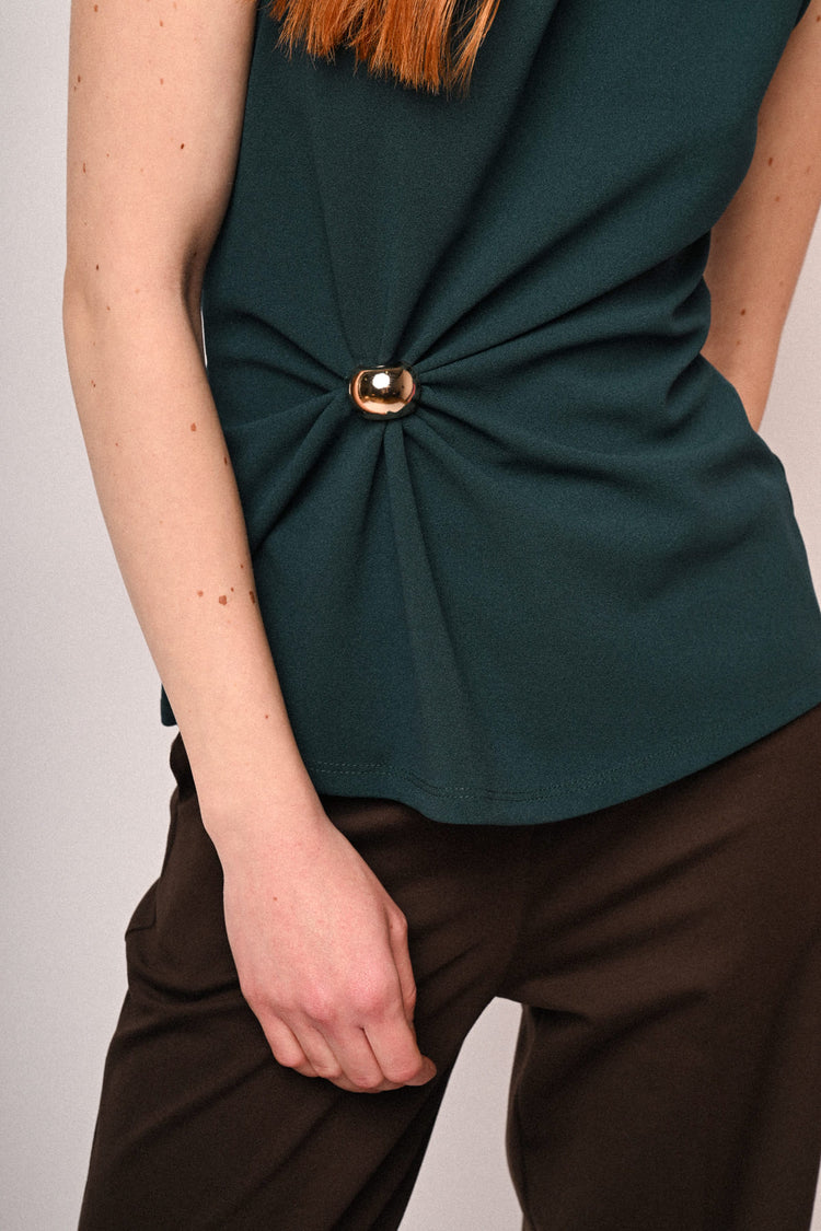 Top con sfera e drappeggio