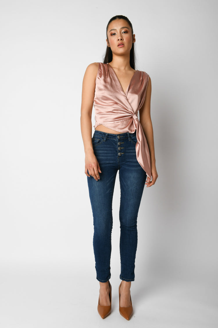 Jeans skinny con bottoni gioiello