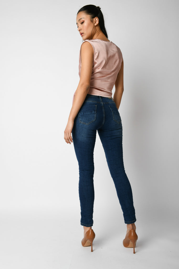 Jeans skinny con bottoni gioiello