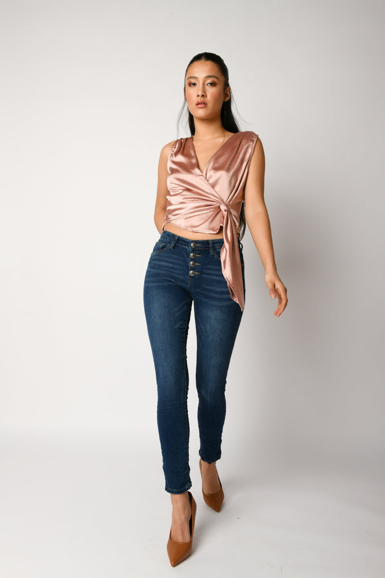 Jeans skinny con bottoni gioiello