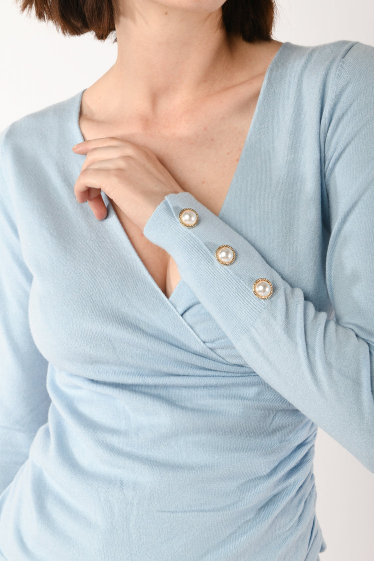 Pull con bottoni gioiello