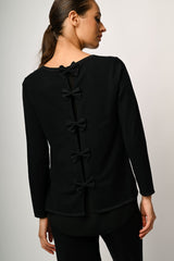 Pull con fiocchi sul retro