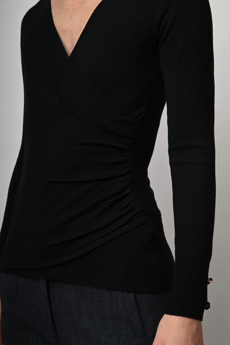 Pull con design incrociato
