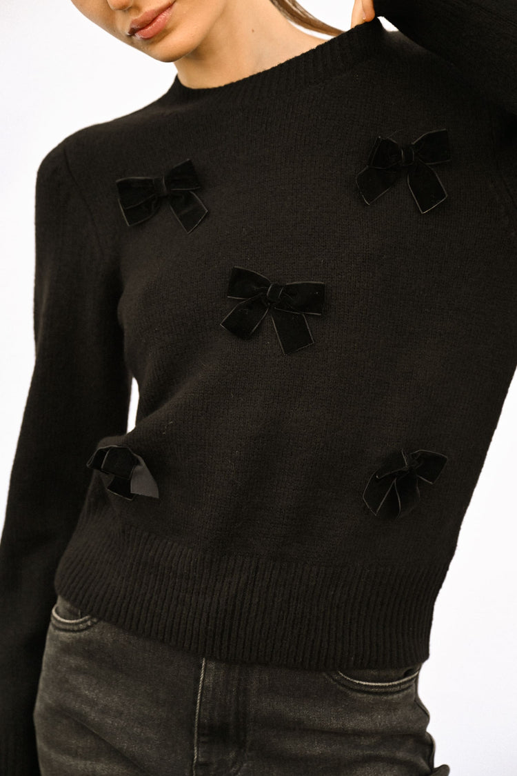 Pull con decorazione fiocchi